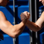 Muscle-Bound Men Challenge a Woman